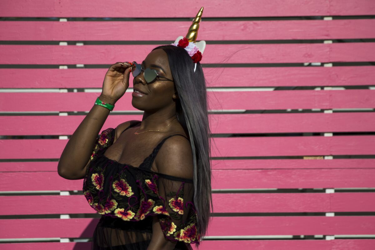 Melisa Occean, 31, of New York, wears just enough flowers on her dress to keep things interesting and transforms the flower crown into a chic, tighter base for her metallic unicorn horn.