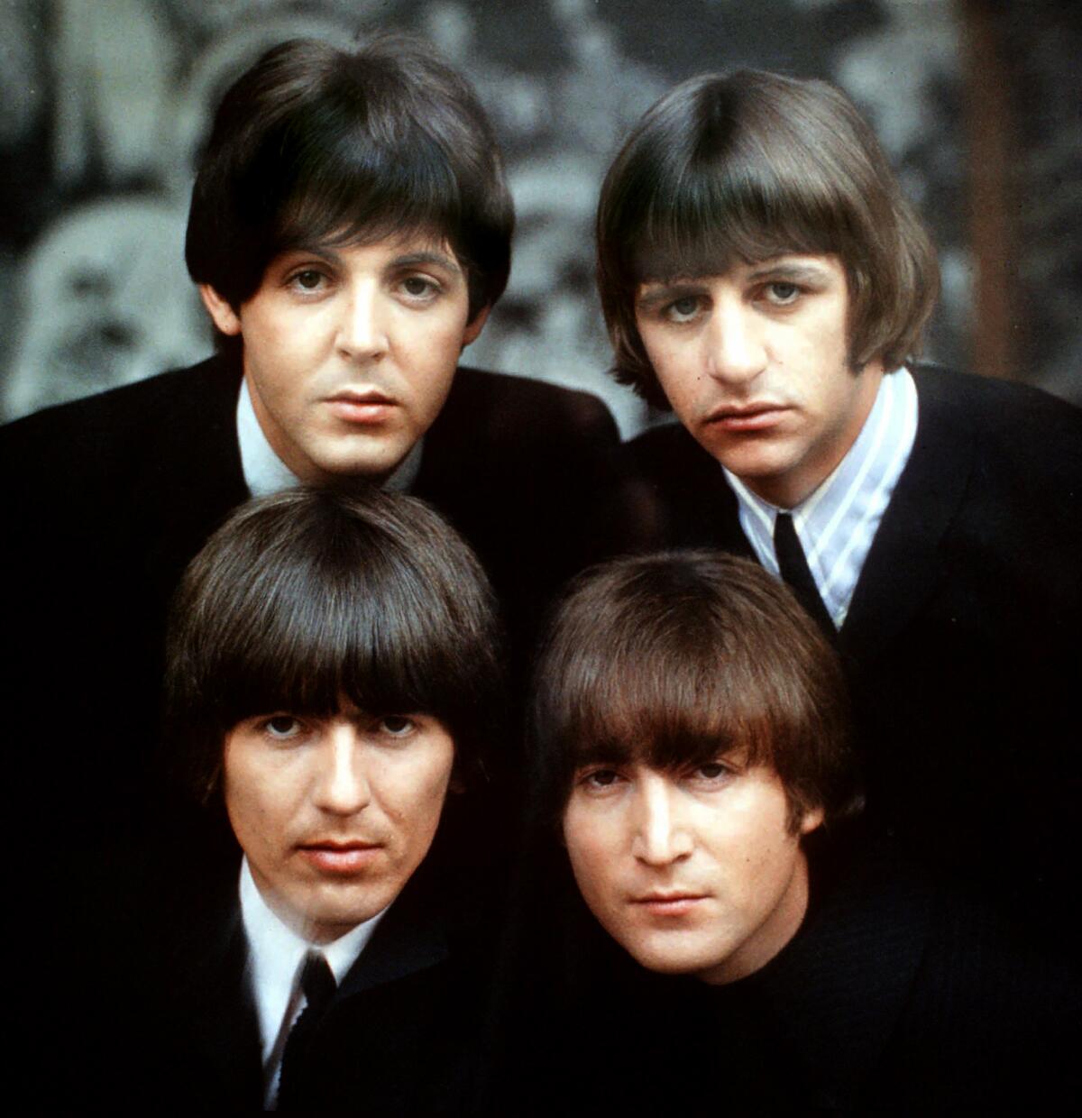 The Beatles, clockwise from top left, Paul McCartney, Ringo Starr, John Lennon, and George Harrison in 1965 in a cover shot for the British EP "Beatles for Sale No. 2" by Robert Freeman.