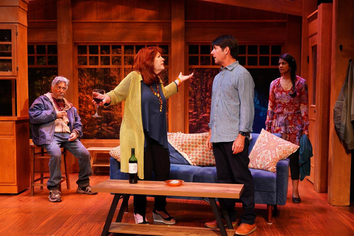 four people in a play in a set that looks like a living room 