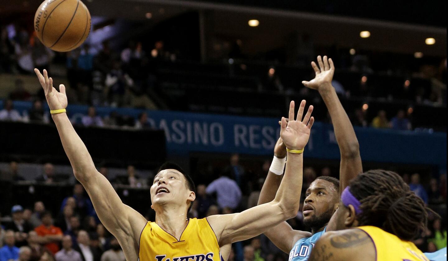 Lakers point guard Jeremy Lin looks to score against Hornets forward Michael Kidd-Gilchrist in the second half.