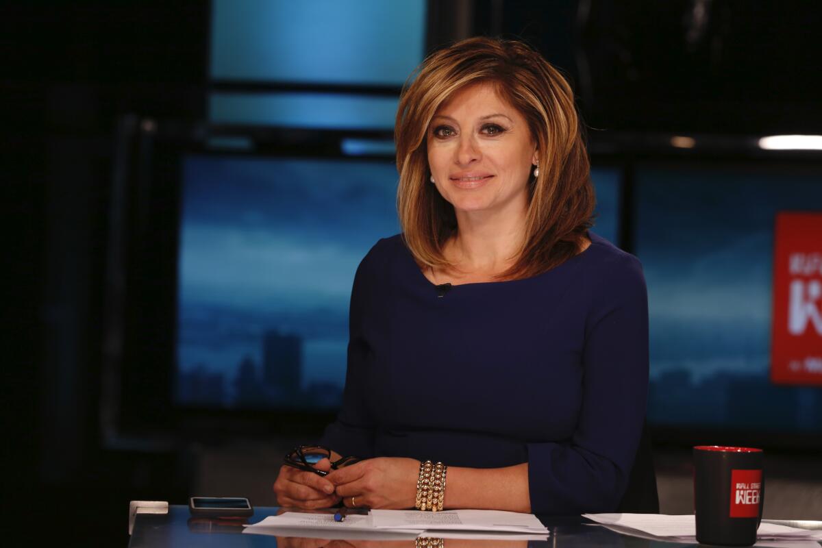 Maria Bartiromo sits at her desk on set