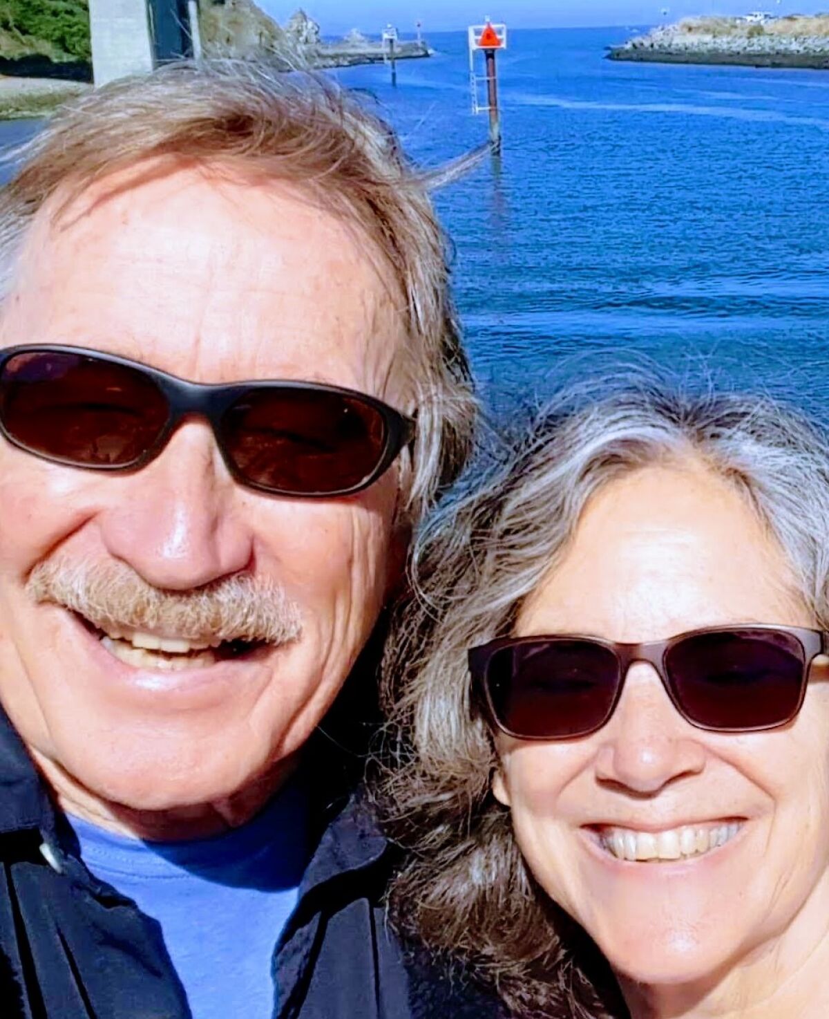 Russel and Jennifer Redmond at the harbor entrance Fort Bragg, 2021