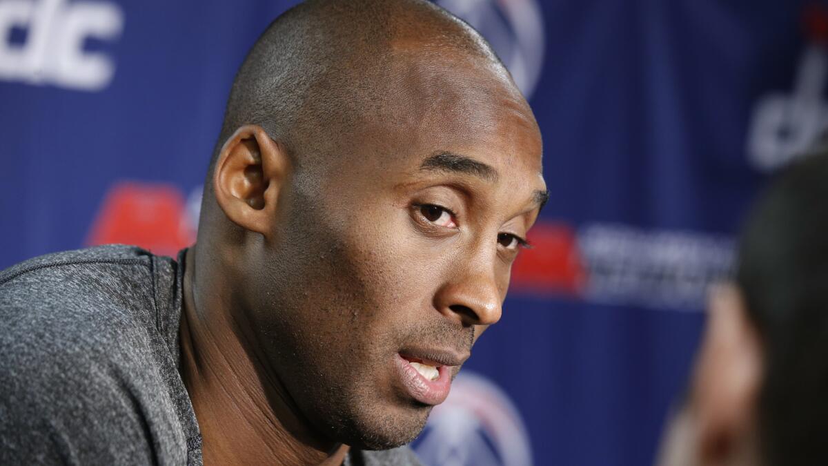 Kobe Bryant talks to the media in Washington before the Lakers played the Wizards on Tuesday.