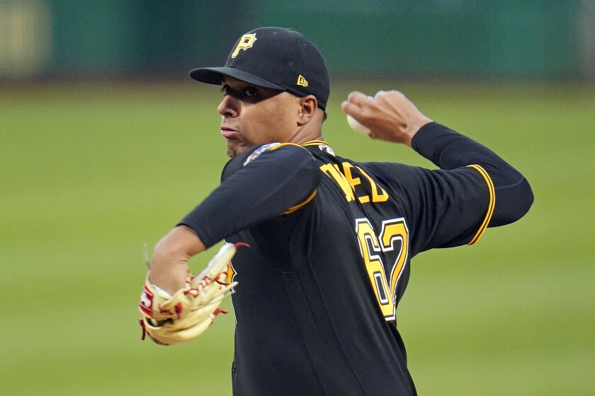 Pittsburgh Pirates starting pitcher Johan Oviedo delivers during the first inning of the team's baseball game against the Chicago Cubs in Pittsburgh, Saturday, Sept. 24, 2022. (AP Photo/Gene J. Puskar)