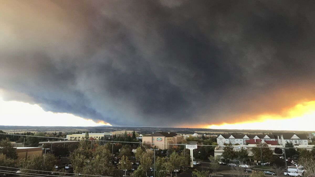 Smoke from the Camp fire fills the sky near Paradise, Calif.