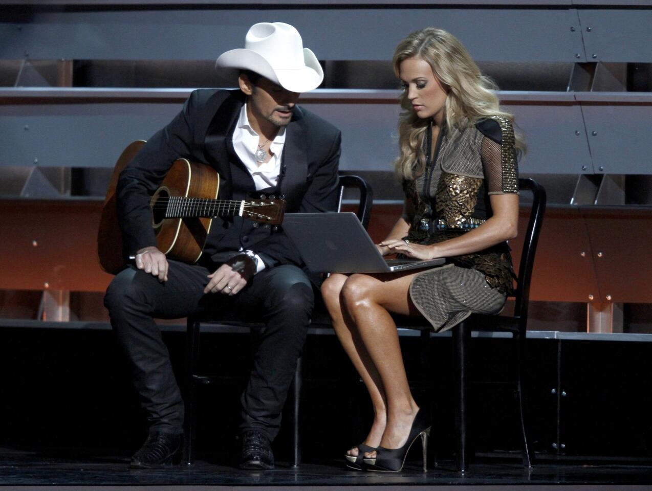 Co-hosts Brad Paisley, left, and Carrie Underwood perform a skit during the opening of the 47th CMA Awards.