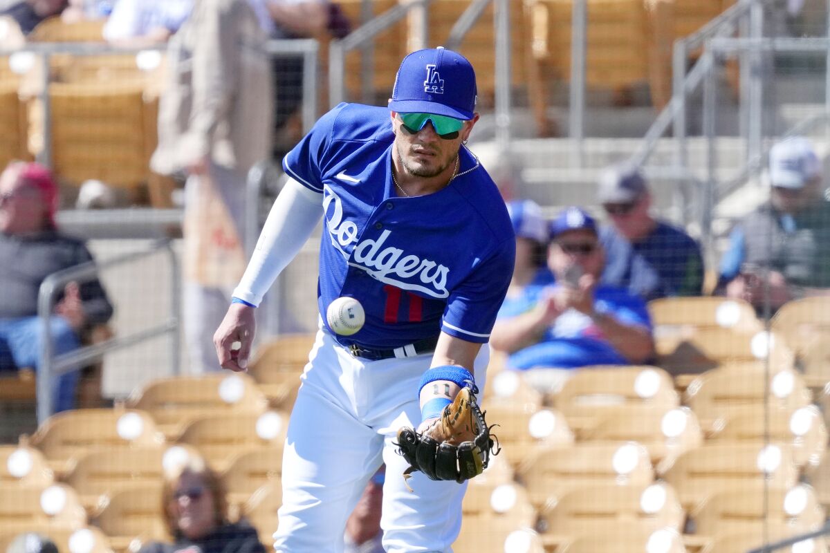 Dodgers shortstop Miguel Rojas warms up before a game against the Cincinnati Reds on Feb. 28.