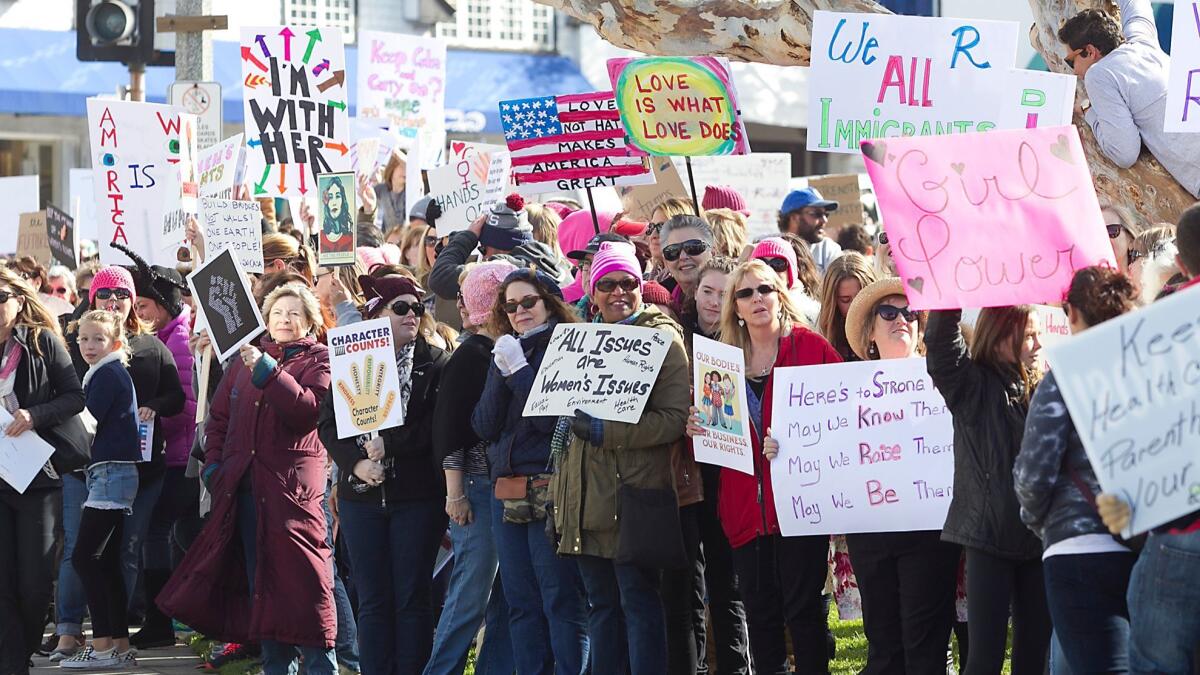 Hundreds of demonstrators lined south Coast Highway in the Laguna Beach Women’s March at Main Beach on Jan. 21, 2017.