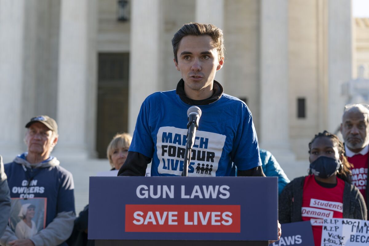 Parkland survivor and activist David Hogg speaks during a rally outside of the U.S. Supreme Court in Washington, Wednesday, Nov. 3, 2021. The Supreme Court is set to hear arguments in a gun rights case that centers on New York's restrictive gun permit law and whether limits the state has placed on carrying a gun in public violate the Second Amendment. (AP Photo/Jose Luis Magana)
