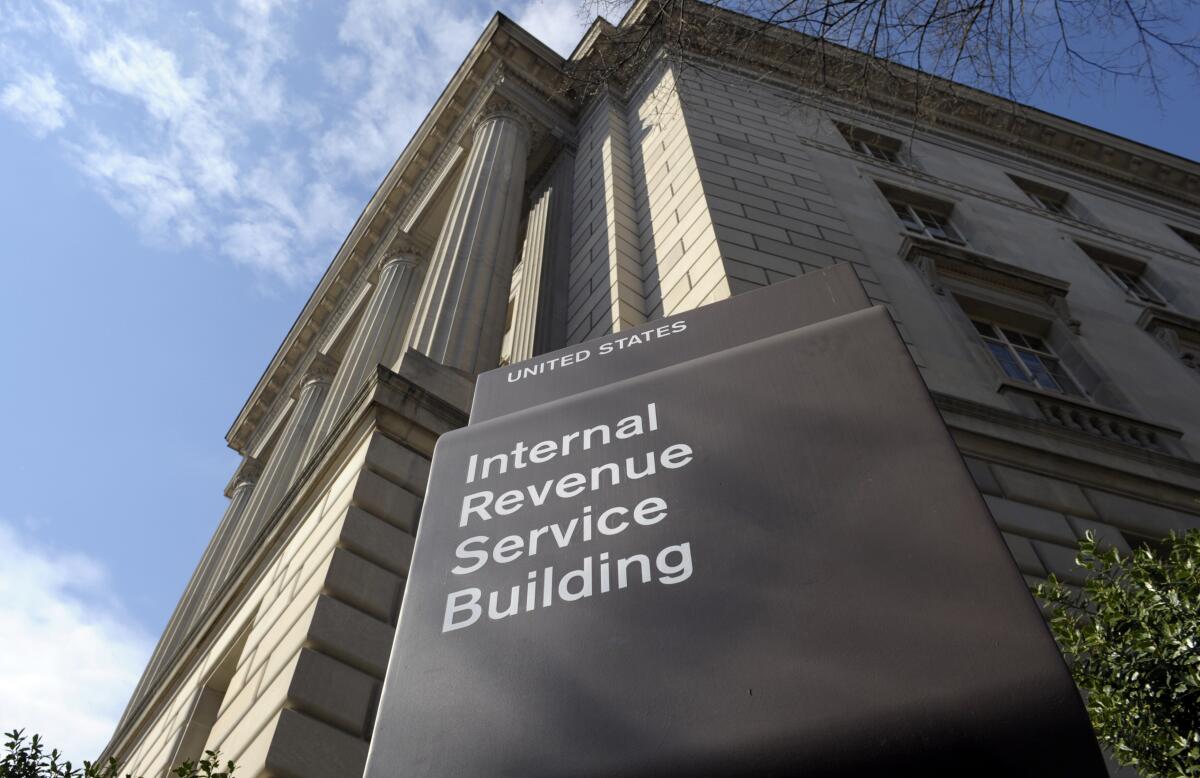 The exterior of a building with an "Internal Revenue Service" sign in white lettering.