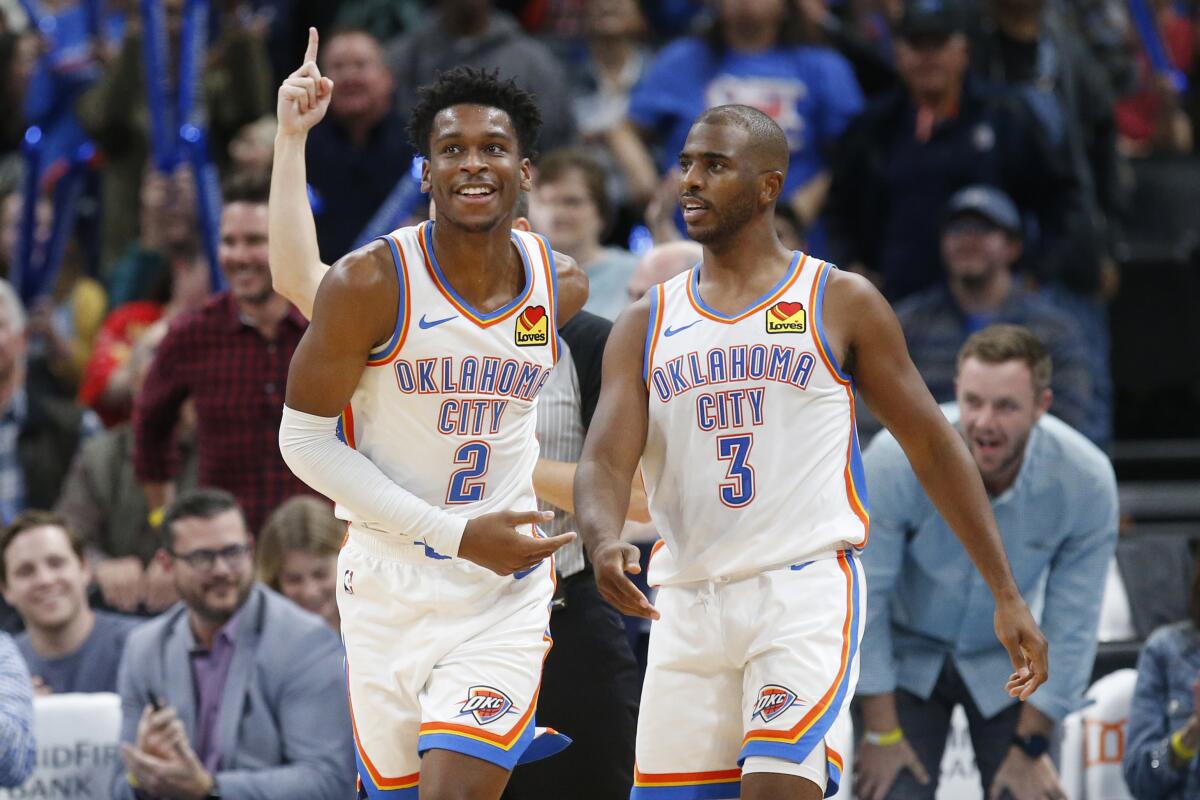 Oklahoma City Thunder guards Shai Gilgeous-Alexander (2) and Chris Paul during a game against the Orlando Magic on Nov. 5, 2019, in Orlando.
