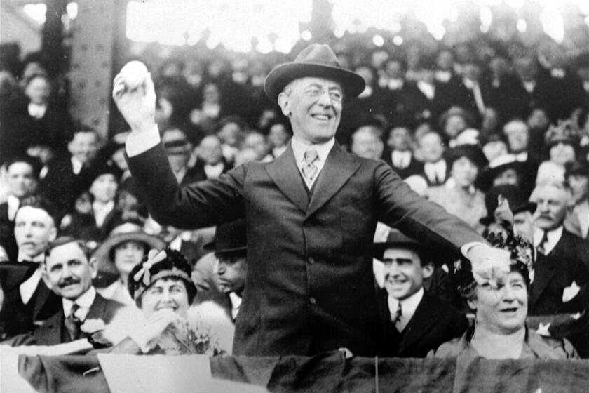 President Woodrow Wilson, shown at a baseball game in 1916, sparked outrage by screening the racist film "The Birth of a Nation" at the White House in 1915.
