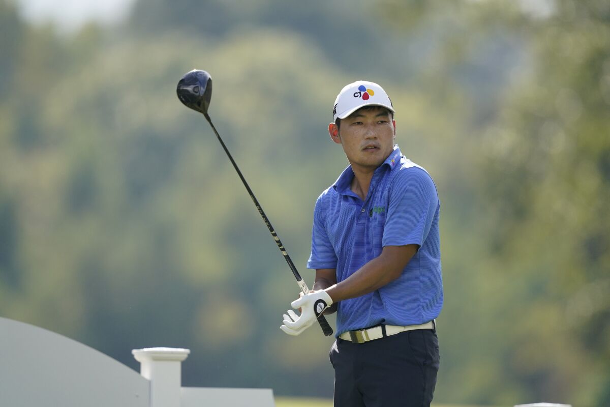 Sung Kang of South Korea adjusts his glove prior to driving off the 18th tee during the second round of the Sanderson Farms Championship golf tournament in Jackson, Miss., Friday, Oct. 1, 2021. (AP Photo/Rogelio V. Solis)