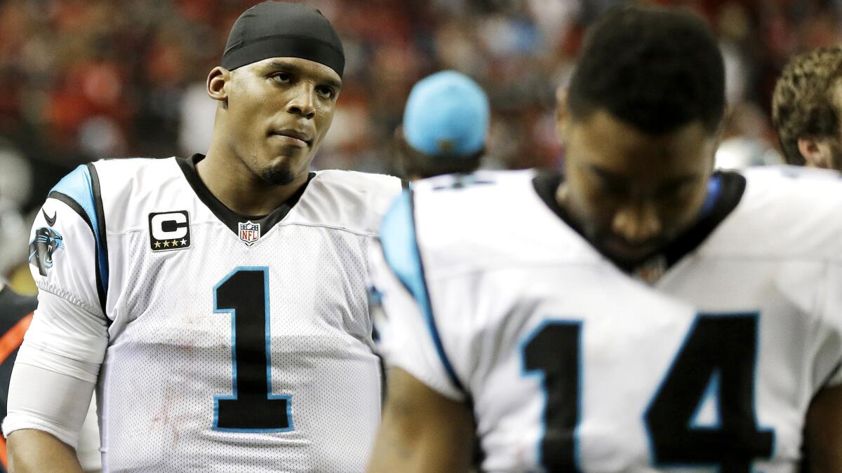 Quarterback Cam Newton (1) leaves the field after the Panthers lost their first game of the season, 17-13 to the Falcons, on Sunday.