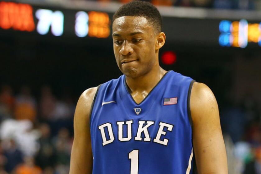 Duke's Jabari Parker walks off the court following the Blue Devils' loss to Virginia in the ACC tournament on March 16.
