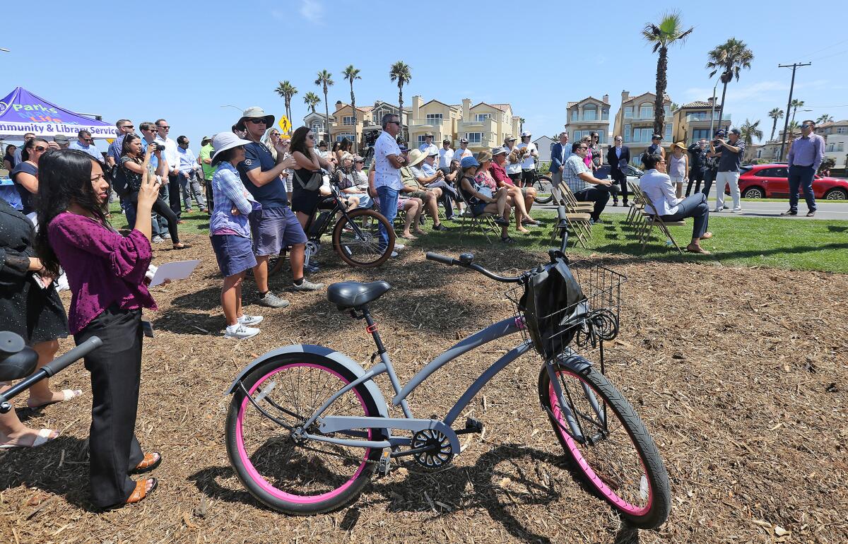 A crowd attends the city of Huntington Beach ribbon-cutting ceremony at Bluff Top Park on Monday.