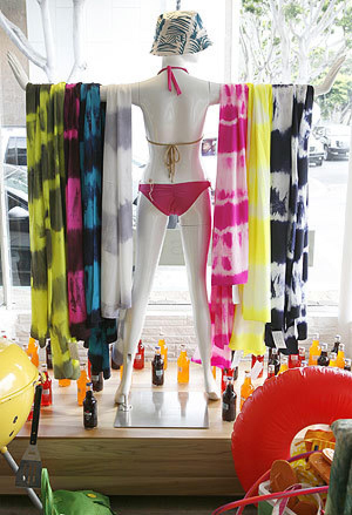 Bright scarves sell quickly at Laguna Supply, purveyor of breezy dresses and tops too.