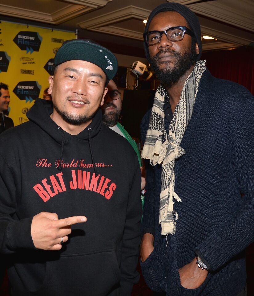 Chef Roy Choi, left, and actor-musician Gary Clark Jr. pose for photos at the premiere of "Chef."