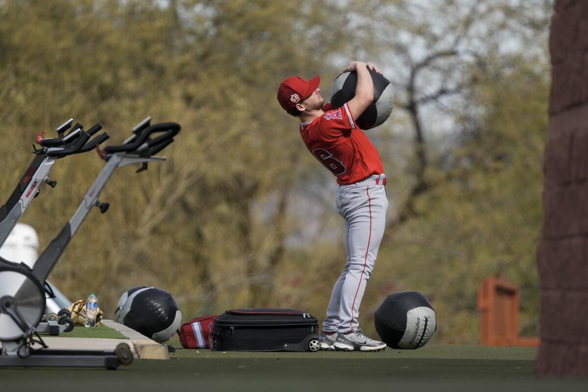 Angels pitcher Kolton Ingram stretches during a training session Friday in Tempe, Ariz.