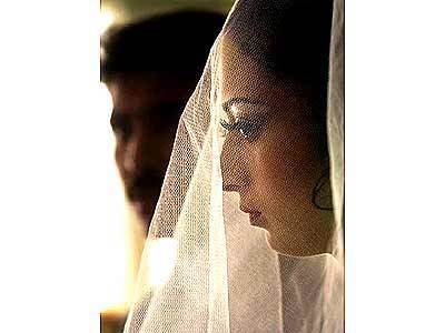 Nabila, 18, who is emotional on her wedding day because the loss of her mother, prepares to start the ceremonies