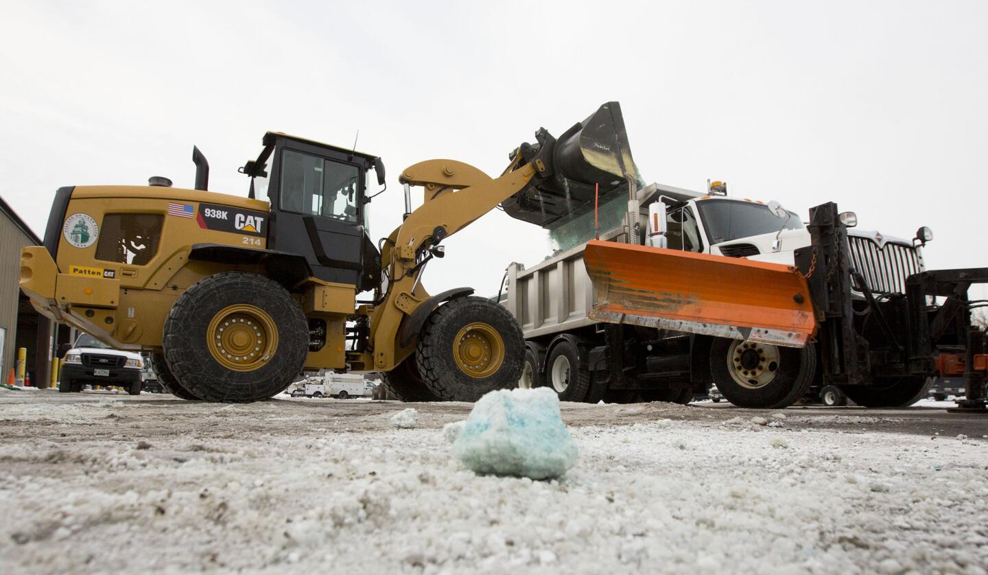 Road salt is loaded into a snow plow truck equipped with a salt spreader at the public works facility in Glen Ellyn, Ill. The Midwest's recent severe winter weather has caused communities to expend large amounts of their road salt supplies.
