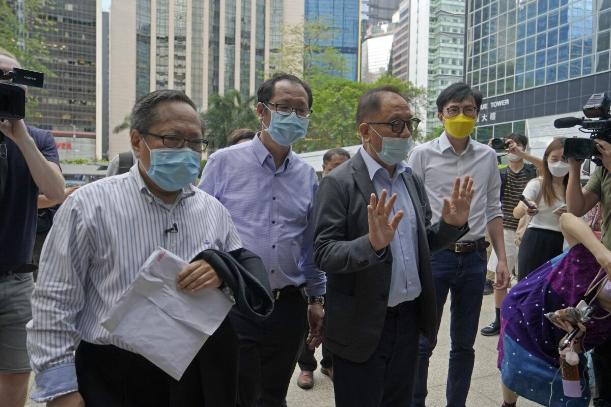 Various defendants including pro-democracy activists, from left, Albert Ho, Richard Tsoi, Yeung Sum and Avery Ng arrive at a court in Hong Kong, Monday, May 17, 2021. Trial starts for Jimmy Lai and nine others, accused of "incitement to knowingly take part in an unauthorized assembly" for a protest march on Oct. 1, 2019. The court has estimated 10 days for this trial. (AP Photo/Kin Cheung)