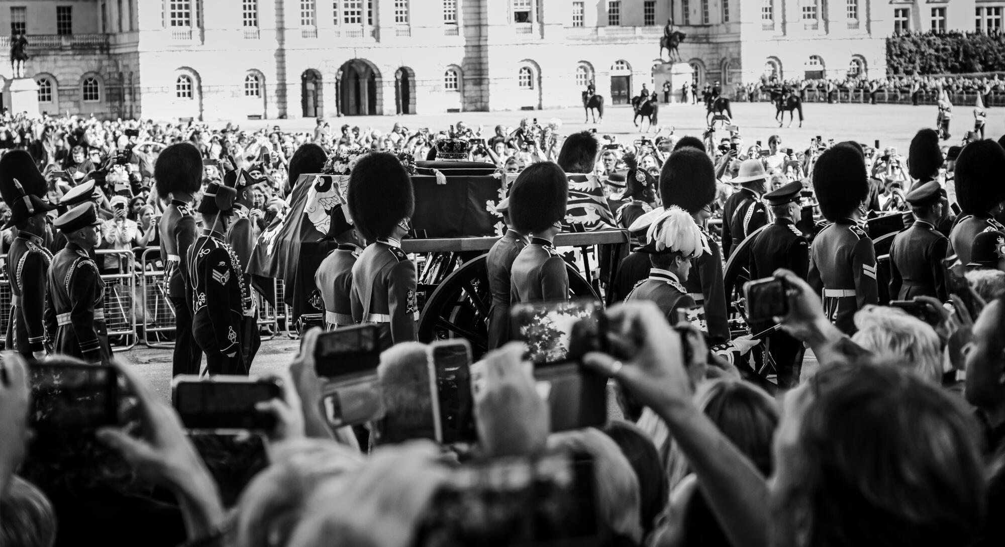 The hearse bearing Queen Elizabeth II travel along a procession route towards Westminster Hall.