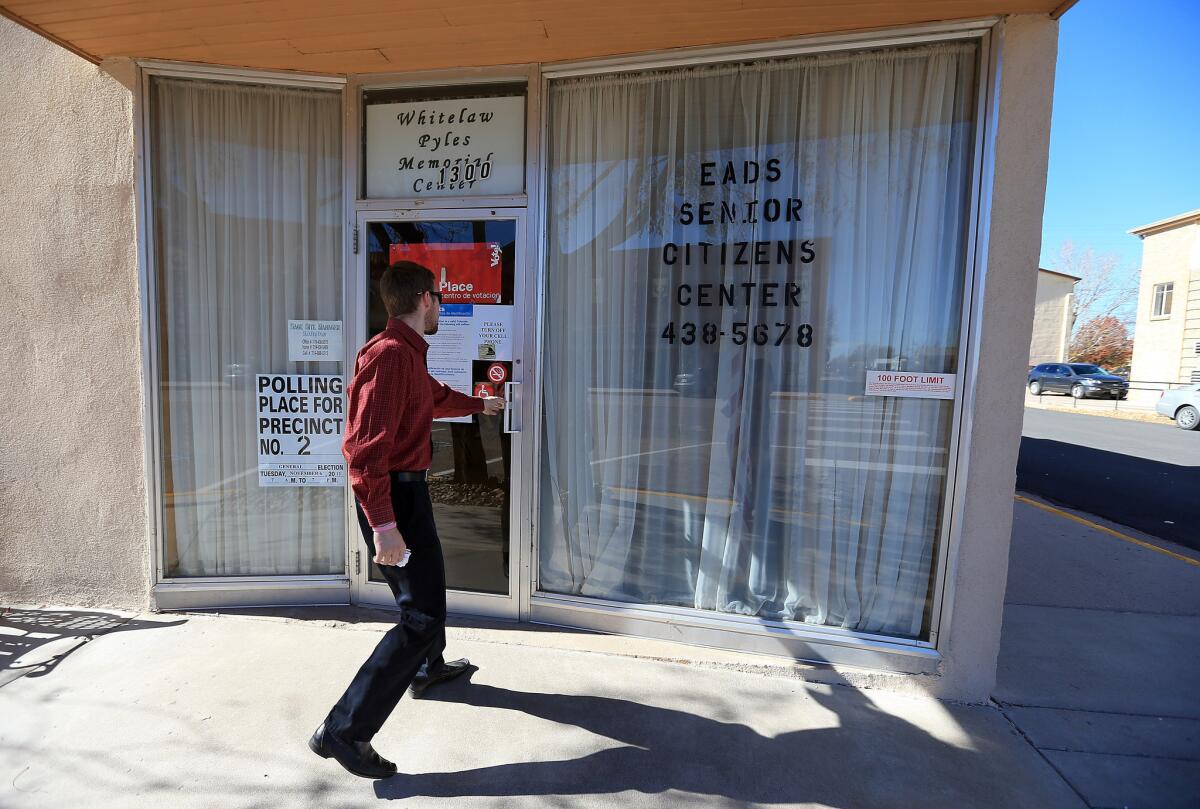 Matt Smith enters the polling place for Kiowa County Precinct 2 at the Eads Senior Citizens Center to vote in Eads, Colo.