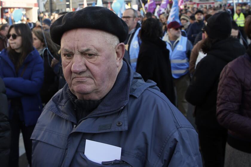 Demonstrators attend a protest march, in Bayonne, southwestern France, Tuesday, Jan. 31, 2023. French labor leaders hope to bring more than 1 million demonstrators into the streets again in the latest clash of wills with the government over plans to push back France's retirement age. (AP Photo/Robert Edme)