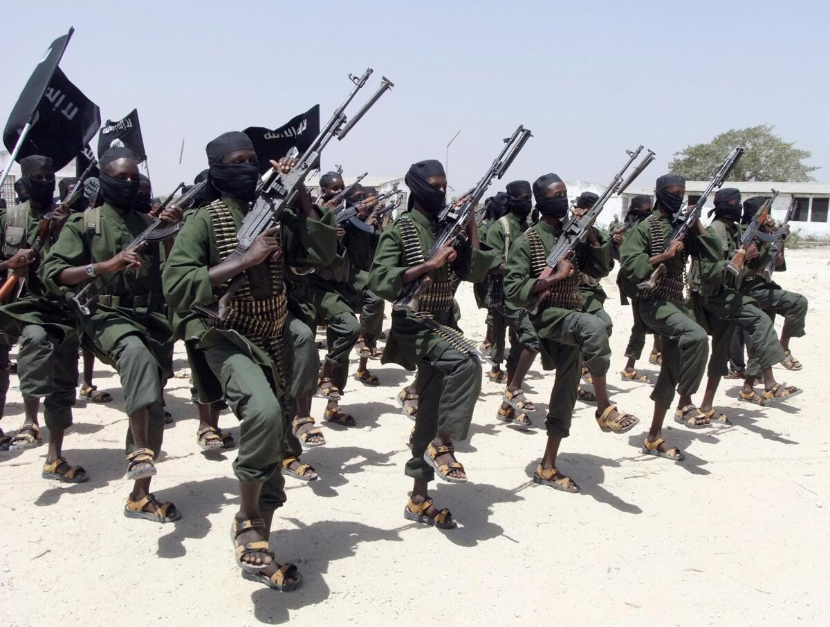 In this Feb. 17, 2011, photo, newly trained Shabab fighters perform military exercises in the Lafofe area south of Mogadishu, Somalia.