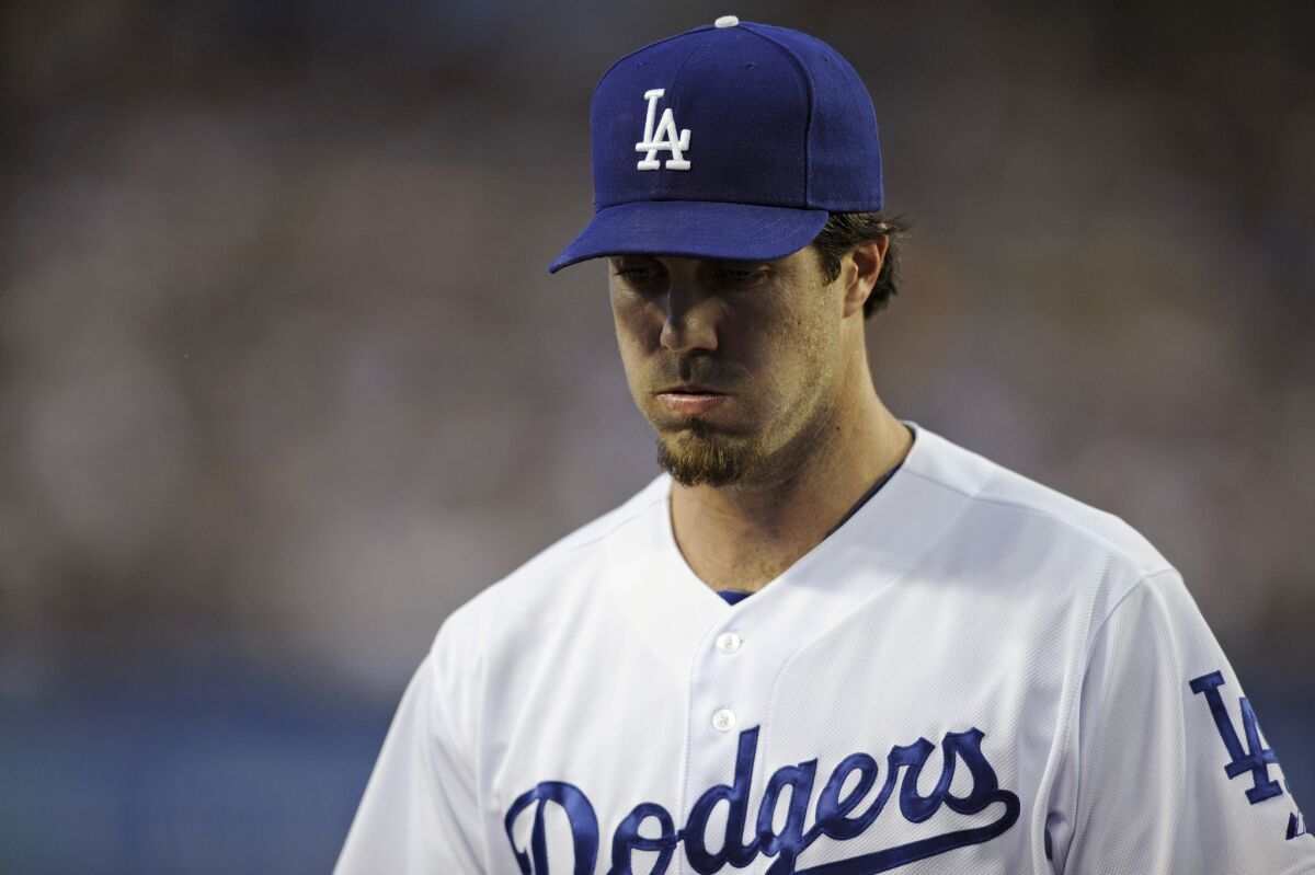 Los Angeles Dodgers starting pitcher Dan Haren is seen during Tuesday's game against the Tigers, which aired on SportsNet LA, distributed by Time Warner Cable. Negotiations with DirecTV over the channel have been contentious.