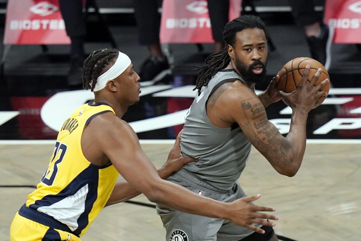FILE - In this Feb. 10, 2021, file photo, Brooklyn Nets' DeAndre Jordan, right, looks for an outlet as Indiana Pacers' Myles Turner (33) defends during the first half of an NBA basketball game in New York. The Detroit Pistons acquired Jordan in a multiplayer trade with the Brooklyn Nets on Saturday, Sept. 4, 2021. The Pistons also received four second-round picks and cash considerations from the Nets in exchange for forward Sekou Doumbouya and center Jahlil Okafor.(AP Photo/Frank Franklin II, File)