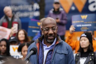 Democratic Sen. Raphael Warnock speaks during an election day canvass launch on Tuesday, Dec. 6, 2022, in Norcross, Ga. Sen. Warnock is running against Republican candidate Herschel Walker in a runoff election. (AP Photo/Brynn Anderson)