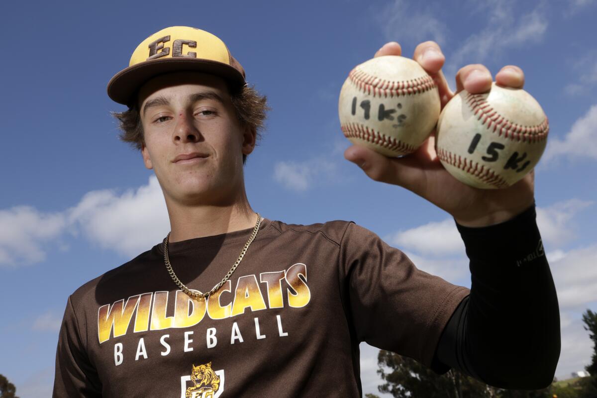 El Camino pitcher Zane Nordquist holds his two no-hitter baseballs during Wednesday's practice.