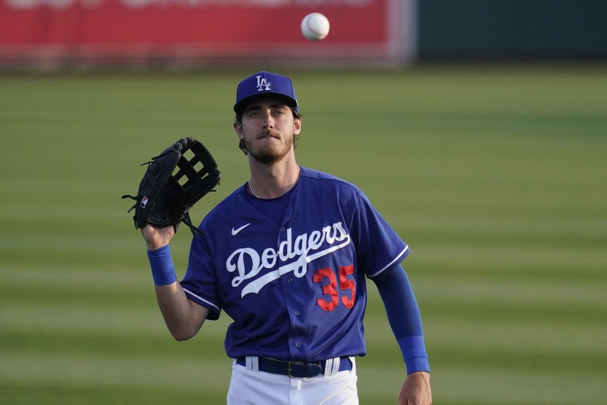 Los Angeles Dodgers' Cody Bellinger warms up prior to a spring training baseball game.