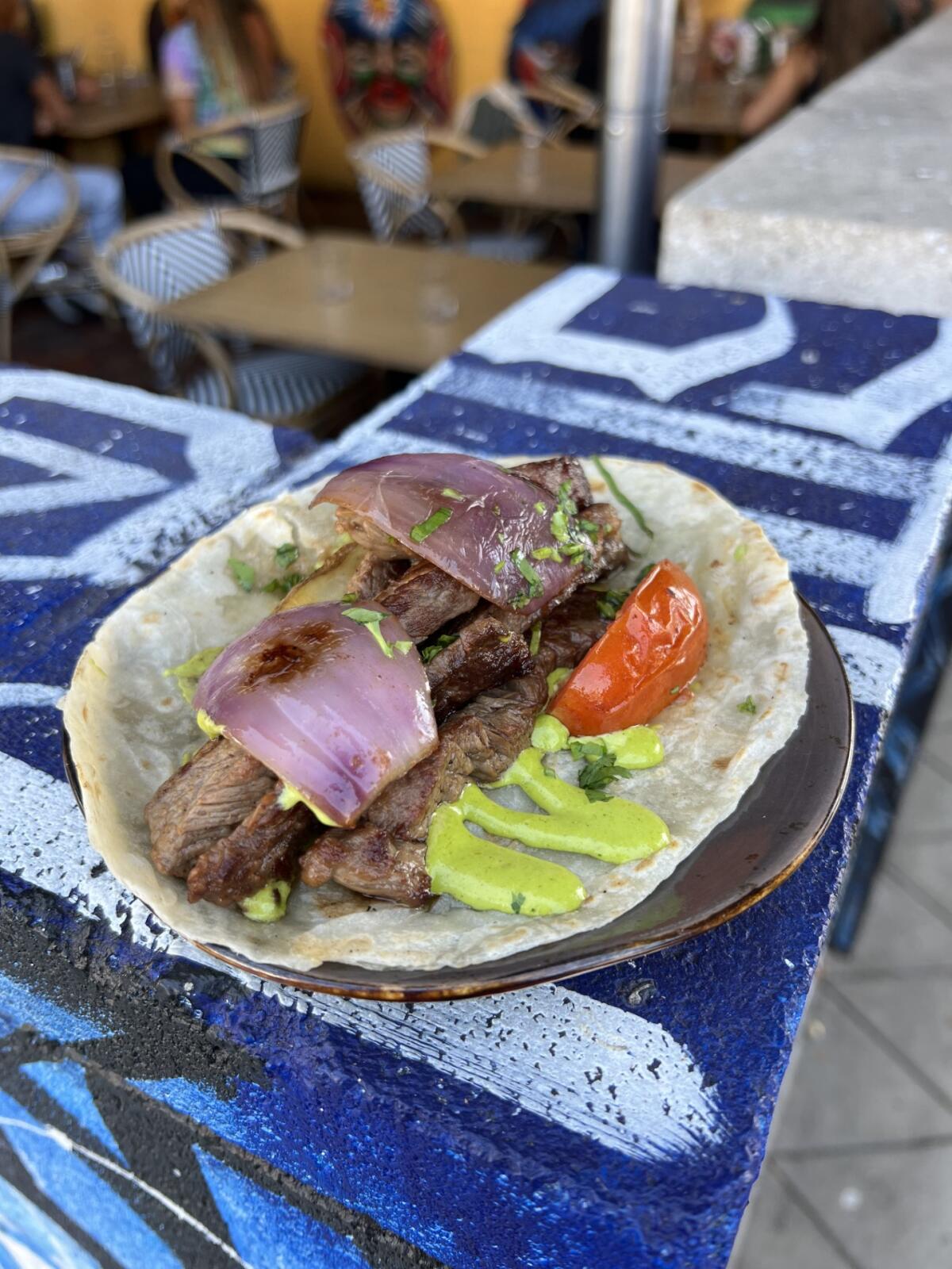 The lomo saltado taco at Guerrilla Tacos