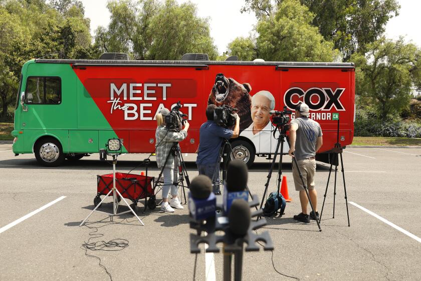 IRVINE-CA-AUGUST 24, 2021: GOP gubernatorial hopeful John Cox arrives on his tour bus to unveil an education plan which his campaign says will, "keep schools open and return power to parents," at a news conference at Heritage Park in Irvine on Tuesday, August 24, 2021. (Christina House / Los Angeles Times)