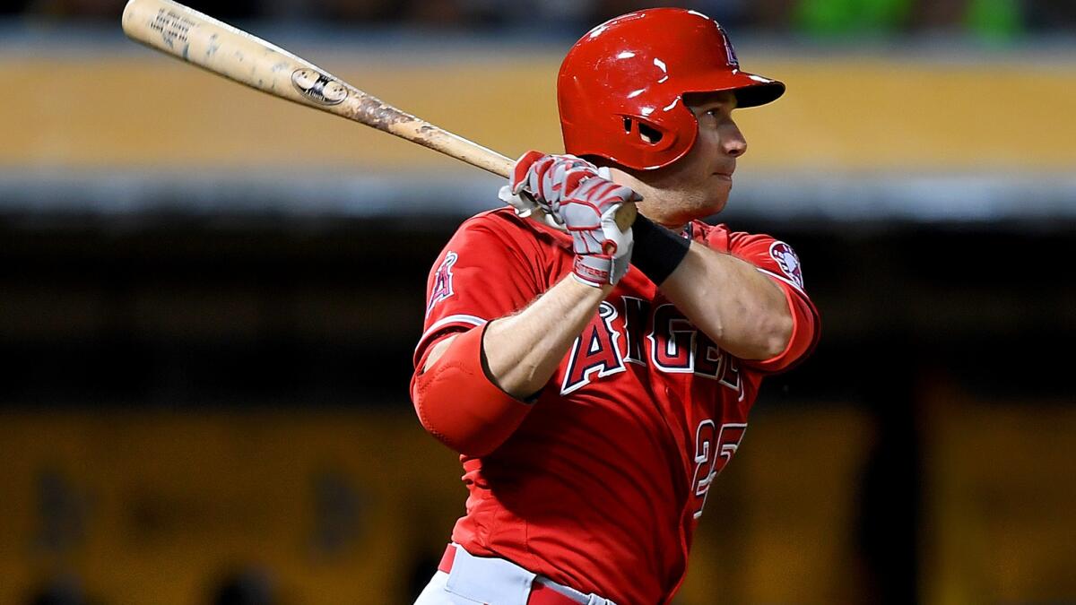 Angels left fielder Daniel Nava follows through on a run-scoring single against the Athletics during a game earlier this season.