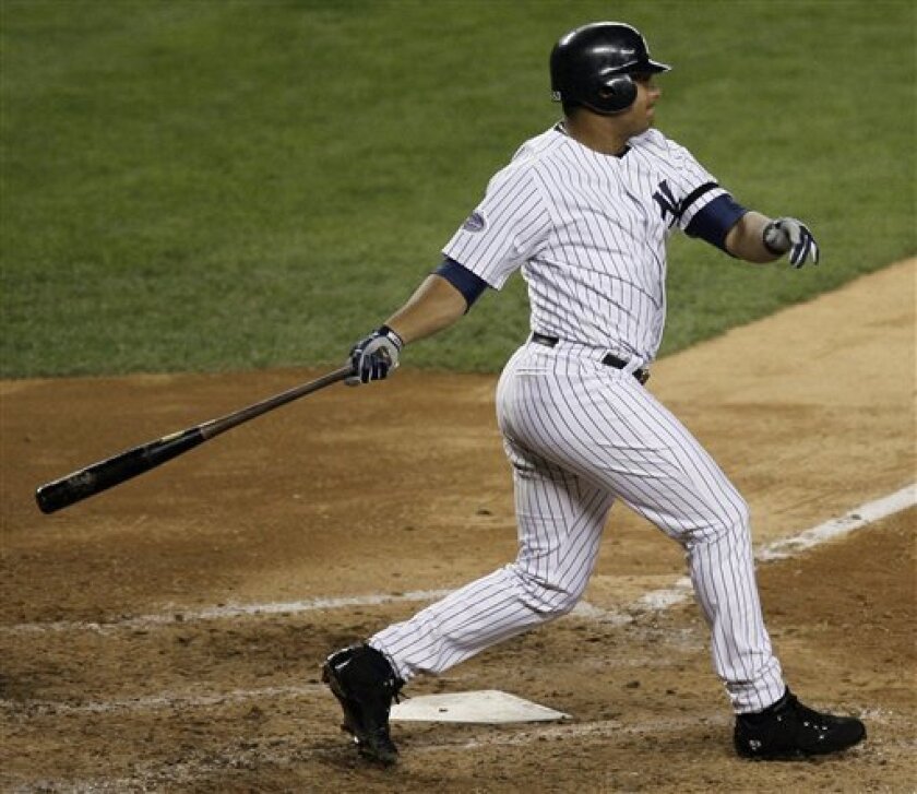 New York Yankees' Bobby Abreu follows through on a two-run single to right field during the fourth inning against the Chicago White Sox in a baseball game Thursday, Sept. 18, 2008, at Yankee Stadium in New York. (AP Photo/Julie Jacobson)