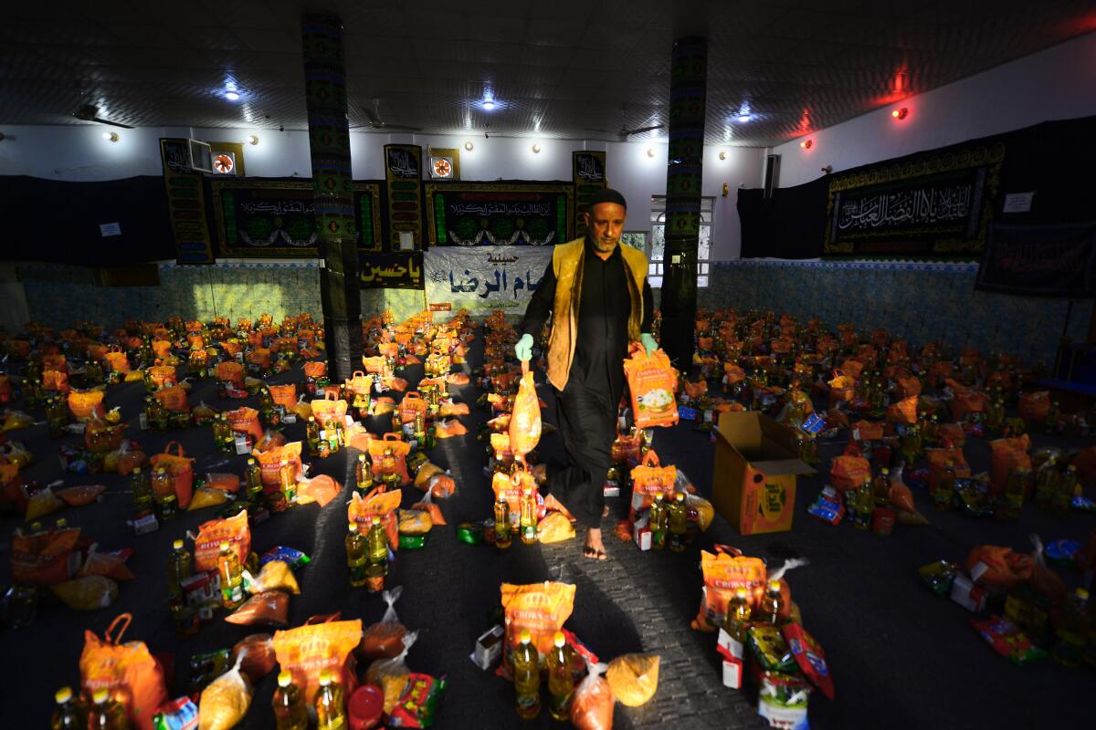 A man sorts donations in the central Iraqi holy city of Najaf.