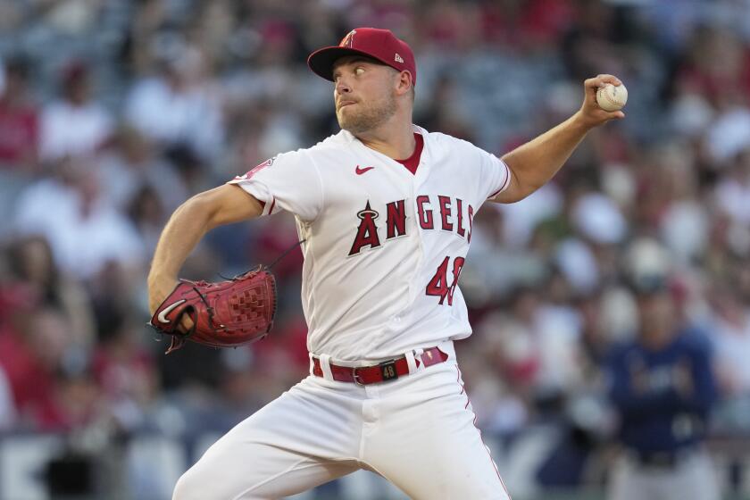 Los Angeles Angels starting pitcher Reid Detmers (48) throws during the first inning of a baseball game.