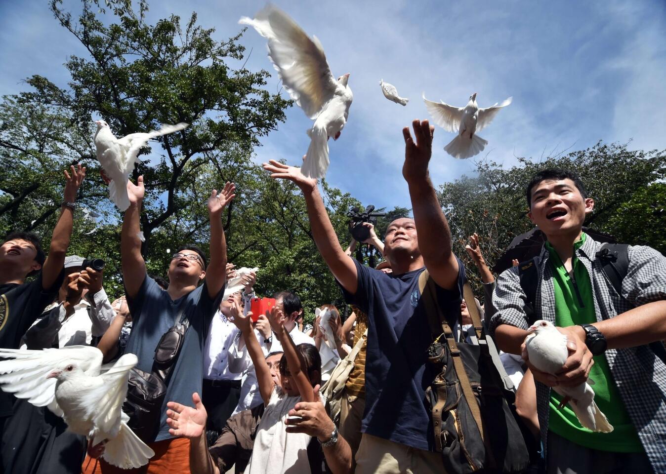 White doves are released during an Aug. 15 ceremony at Tokyo's Yasukuni shrine as Japan marks the 69th anniversary of its surrender in World War II.