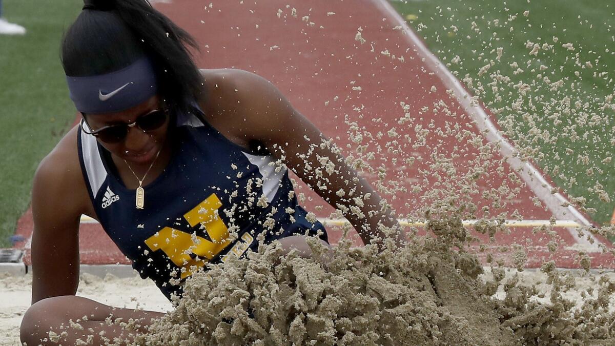 John W. North High's Sydney Reid competes in the Girls Division I long jump