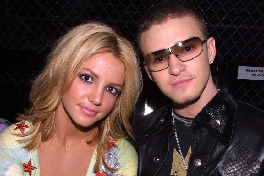 Britney Spears and Justin Timberlake posing for a photo