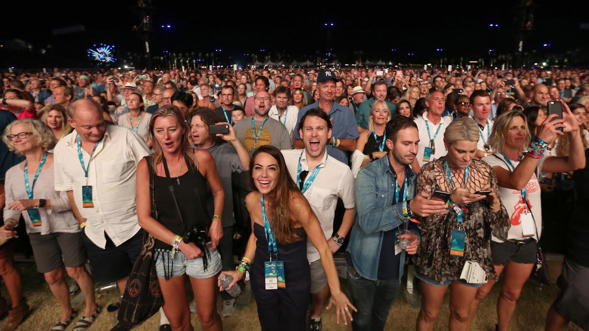 Music fans react to a performance from the Rolling Stones during Desert Trip's second weekend.