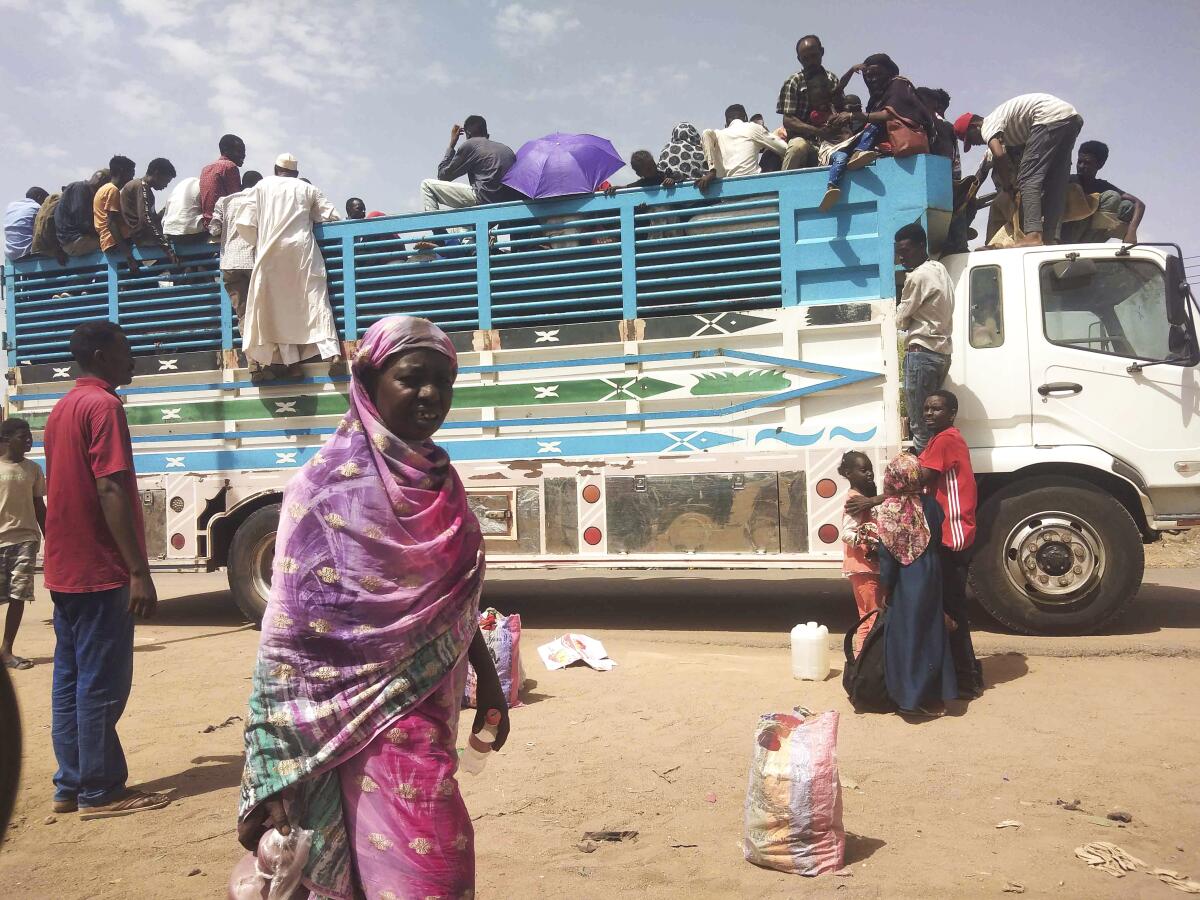 People board a truck in Khartoum, Sudan. 
