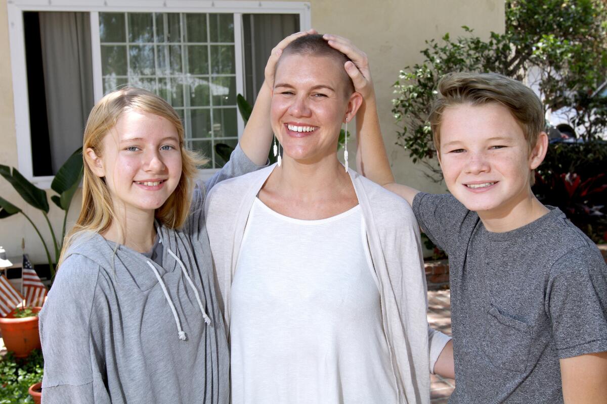 Joanna Peresie with her children Ella, left, and Benjamin, right, at their Burbank home on Thursday, June 16, 2016.