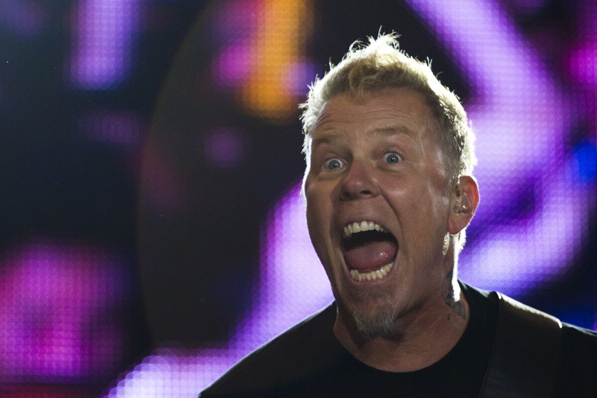 James Hetfield of Metallica performs during the Rock in Rio music festival in Rio de Janeiro, Brazil, Monday, Sept. 26, 2011. The festival, which runs through Oct. 2, includes performances by Katy Perry, Rihanna, Stevie Wonder, Red Hot Chili Peppers, Metallica, Guns N' Roses and Coldplay. (AP Photo/Felipe Dana)