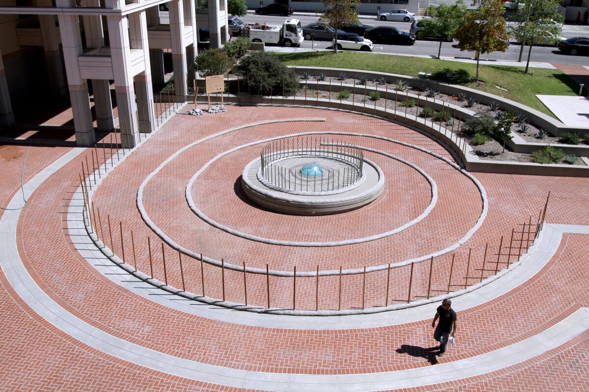 A new art installation called "Water Finds A Way" has been placed at Perkins Plaza near city hall, in Glendale, shown on Friday, September 18, 2015.