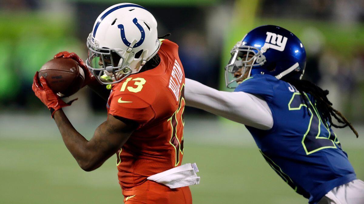 AFC wide receiver T.Y. Hilton of the Indianapolis Colts, left, makes a catch over NFC cornerback Janoris Jenkins of the New York Giants during the first half of the NFL Pro Bowl football game on Jan. 29.